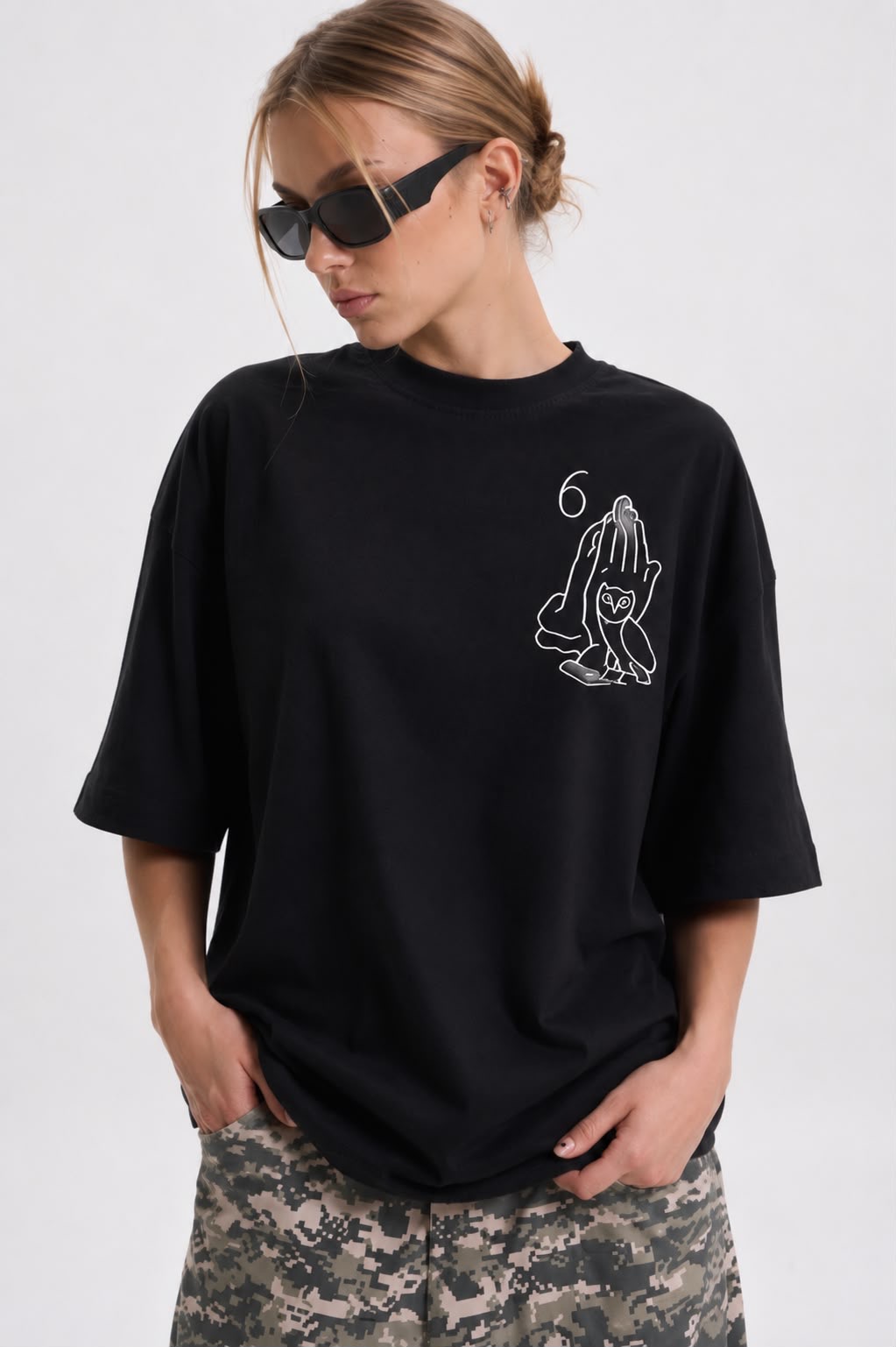 Close-up of the Studio Lyn praying hands tee